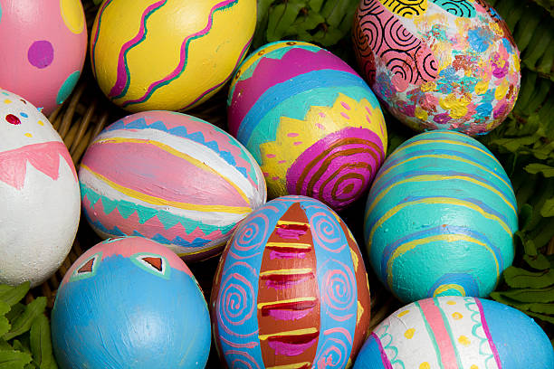 Easter Eggs colorful painted with green fern stock photo