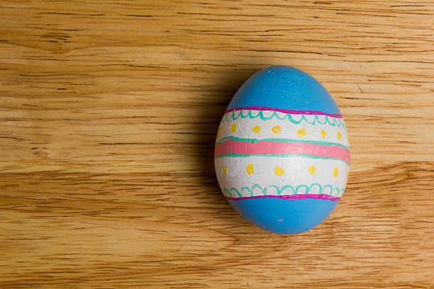 One of Easter Eggs colorful painted on board stock photo