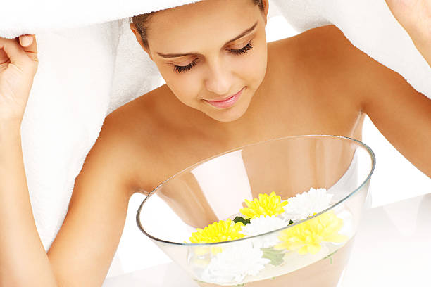 Facial treatment in home spa stock photo