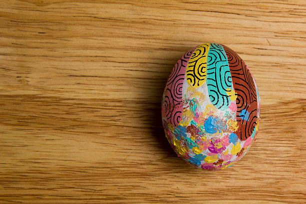 One of Easter Eggs colorful painted on board stock photo