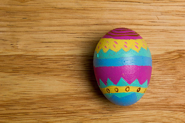 One of Easter Eggs colorful painted on board stock photo