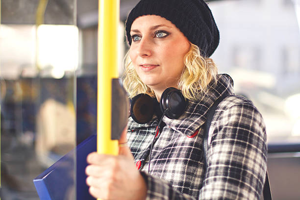 istock Young Blonde Woman on a Bus 506586572
