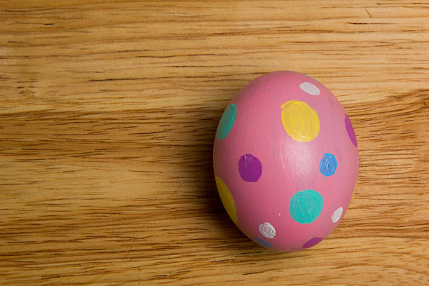 One of Easter Eggs colorful painted on board stock photo