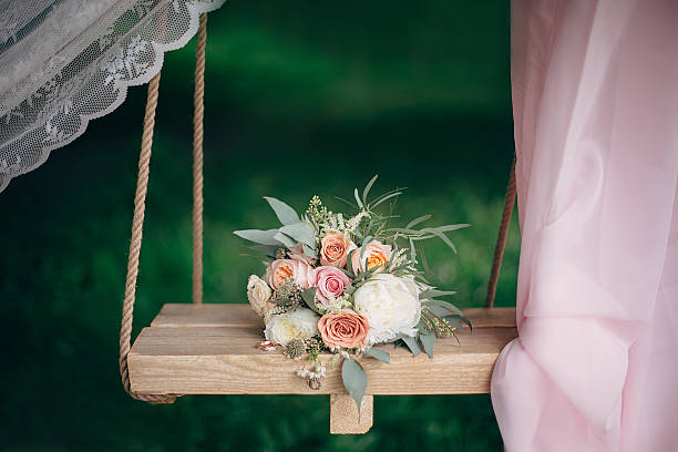 istock bouquet lies on a swing 506587624