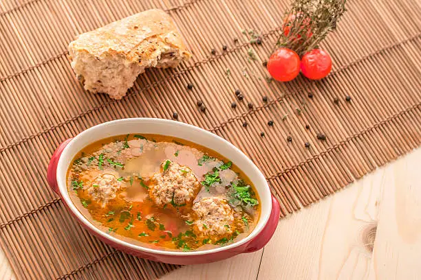 Handmade soup with meatballs , vegetables and rice