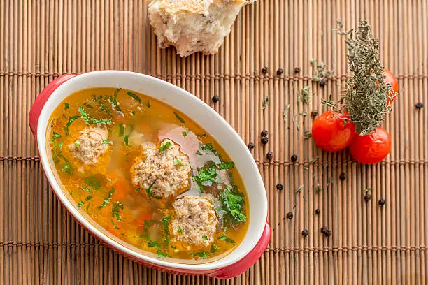 Handmade soup with meatballs , vegetables and rice