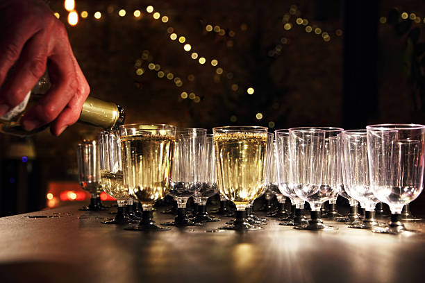istock Waiter pour wine in the glass on holiday reception table. 506589866