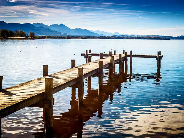 Jetty at the Chiemsee in Germany with blue sky