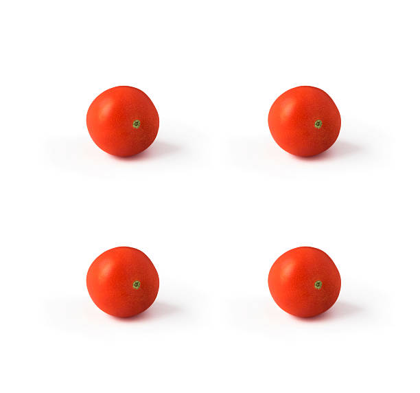 Four tomatoes isolated on white background stock photo