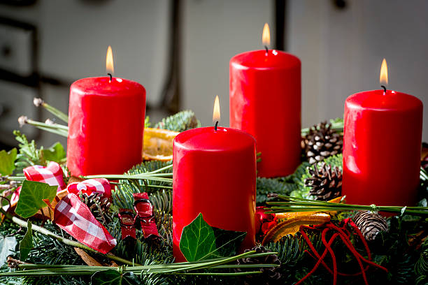 Advent wreath with burning red candles stock photo