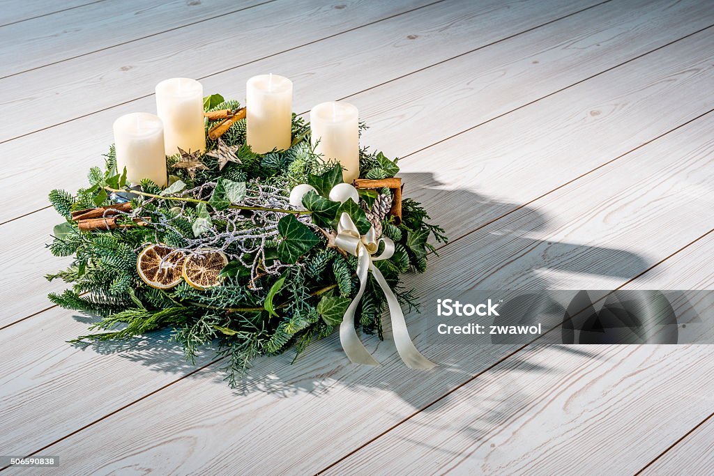 Advent wreath with white candles Advent wreath of twigs with white candles and various ornaments Advent Wreath Stock Photo