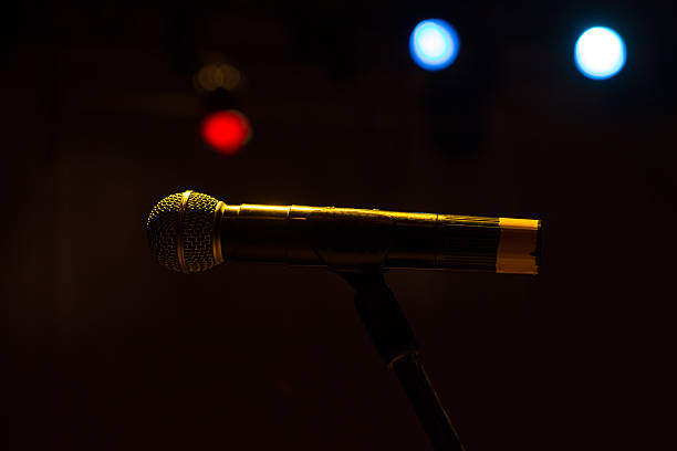istock Image the Close up of microphone in concert hall 506591262