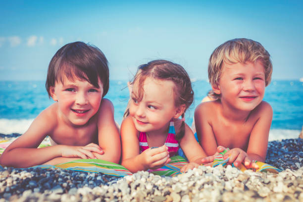 istock Children on the beach 506591584