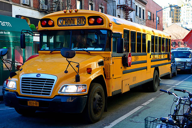 school bus - front view bus photography day stock-fotos und bilder