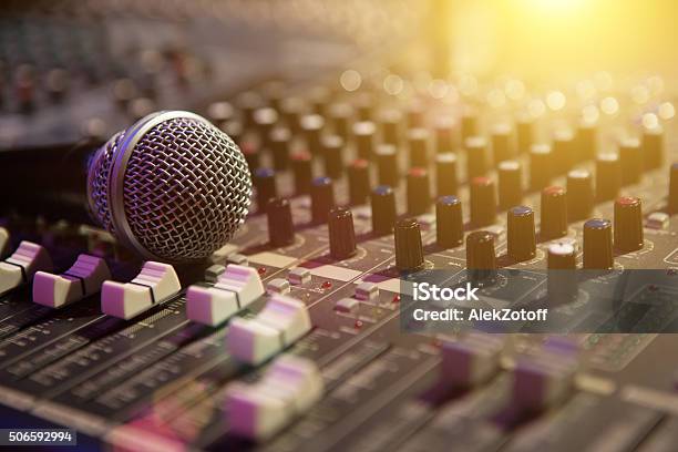 Microphone Resting On A Sound Console Stock Photo - Download Image Now - Sound Mixer, Microphone, Music