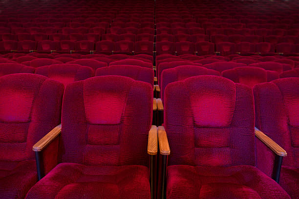 istock Red velvet armchairs in the empty auditorium 506593304