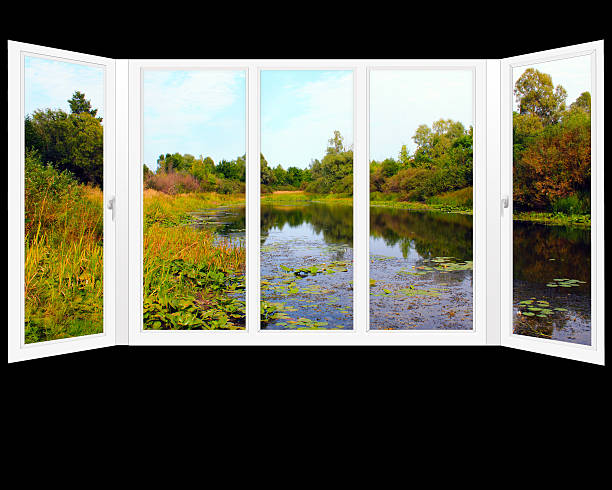 istock window overlooking the summer pond 506593722