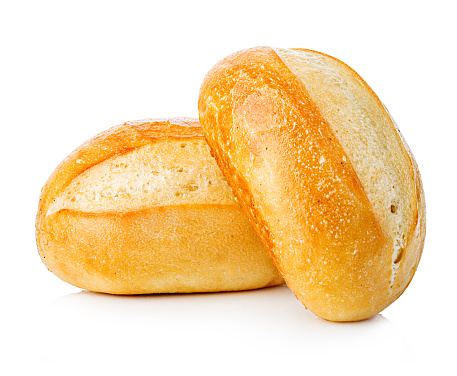 Two loaves of fresh homemade bread close-up isolated on a white background.