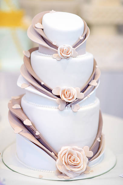 istock White wedding cake decorated with sugar flowers 506594606