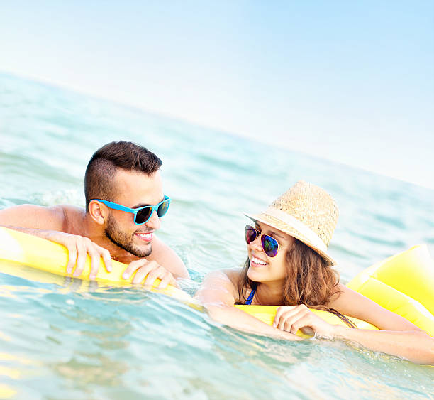 istock Young couple having fun in the sea 506594934