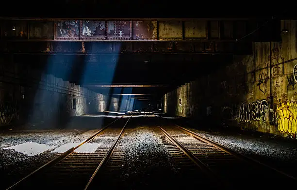Grunge Train Tunnel with light beams, graffiti and dark overtones