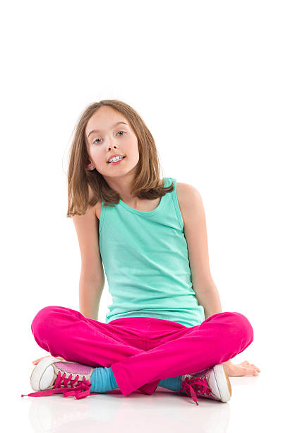 istock Girl sitting with legs crossed 506596673
