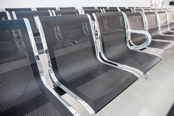istock row of chair in modern office building. 506596829