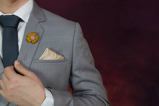 grey suit plaid texture, necktie, brooch, handkerchief