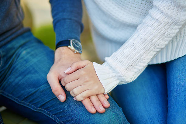 istock Couple holding each others hands 506597150