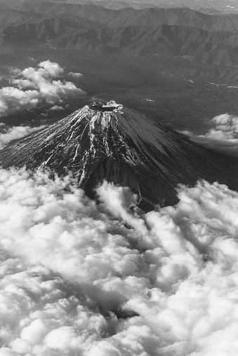 black and white photo of aerial view of Mount Fuji and cloud   from air plane shot in the best position .very lucky  in chance .