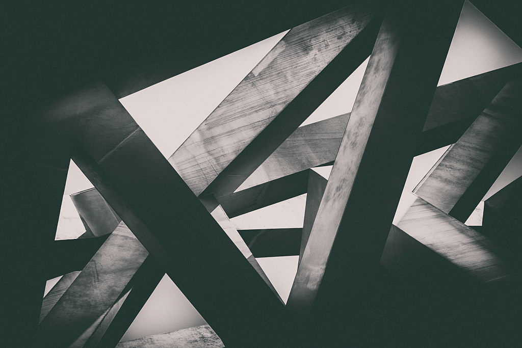 Abstract image of concrete pillars (detail of a building) in black and white.