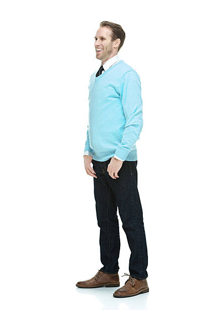 istock Smiling man in sweater & looking away 506599749