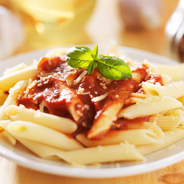 istock penne pasta in tomato sauce 506600873