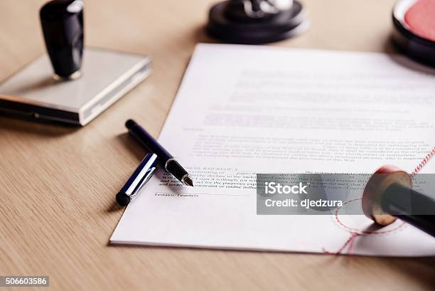 Notary Pen Lying On Testament Stock Photo - Download Image Now - Notary, Shorthand, Document