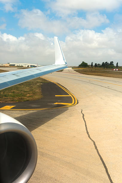 istock Wing and part of a plane engine just landing 506603674