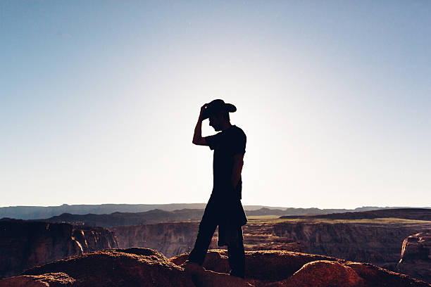 Silhouette of hiker with cowboy hat, Arizona, USA
