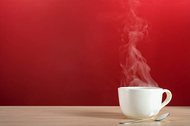 Steamy rising from a large cup of coffee or tea