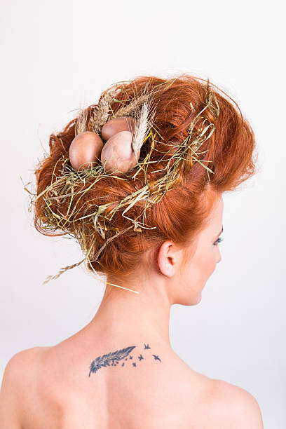 istock Bird's nest and egg in a woman's head 506605498