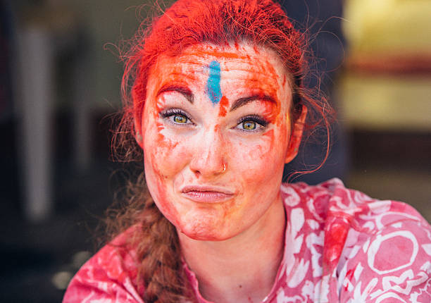 Young woman celebrating Holi Day.