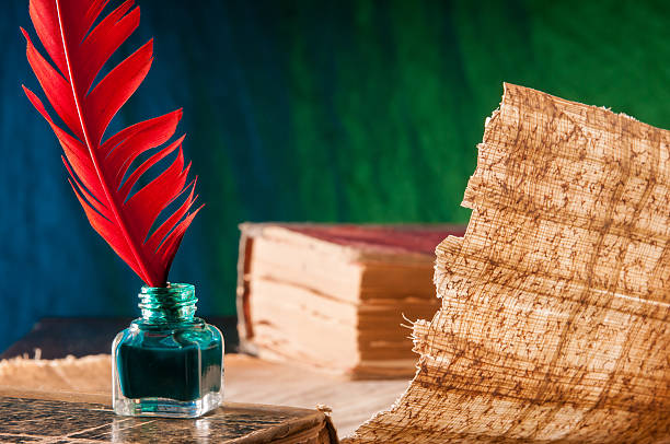 istock Quill pen and papyrus sheet 506607348