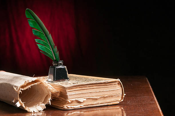 istock Quill pen and papyrus sheet 506607654