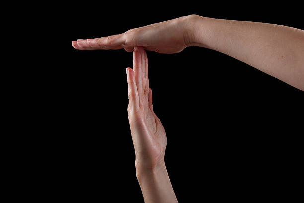 istock Pause or break time hand gesture, shot on black 506607930