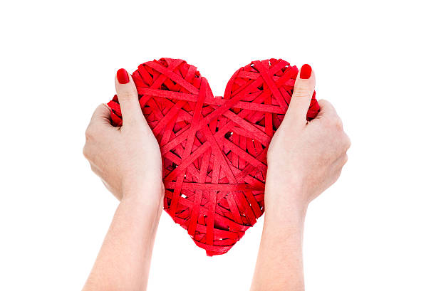 istock Woman Hands Hold Red Wicker Heart 506608588