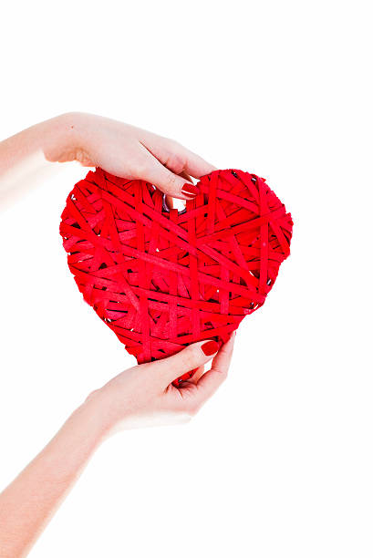 istock Woman Hands Hold Red Wicker Heart 506608640