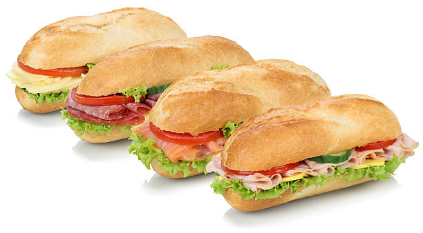 Collection of sub sandwiches baguettes with salami, salmon, ham Collection of sub sandwiches baguettes with salami, salmon, fish, ham and cheese isolated on a white background submarine sandwich photos stock pictures, royalty-free photos & images