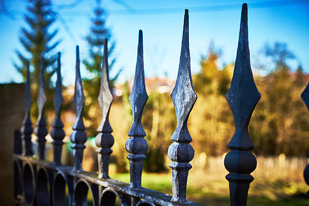 istock terrifying fence with spearheads 506610310