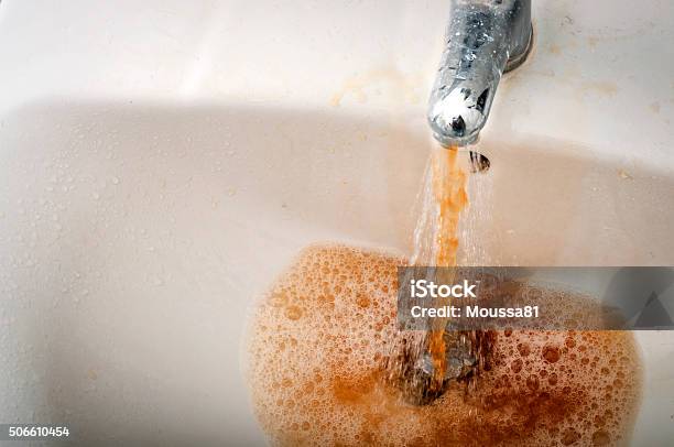 Dirty Brown Water Running From A Filthy Faucet Stock Photo - Download Image Now - Water, Dirty, Unhygienic