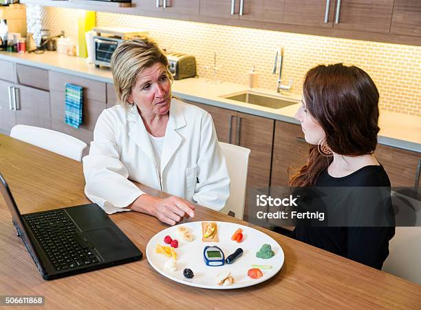 Nutritionist Consulting On Diabetes Stock Photo - Download Image Now - Nutritionist, Discussion, Patient