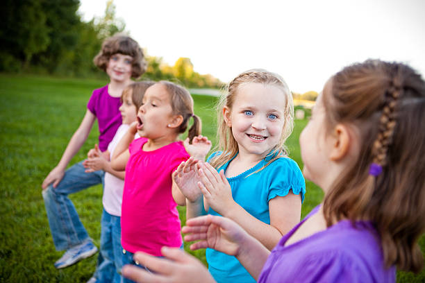 istock Five Happy Young Girls Standing Together Outside 506612172