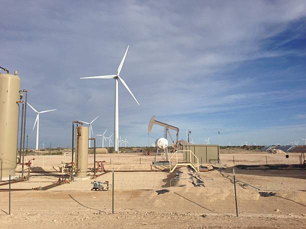 istock Oil Well and Wind Turbine 506613568